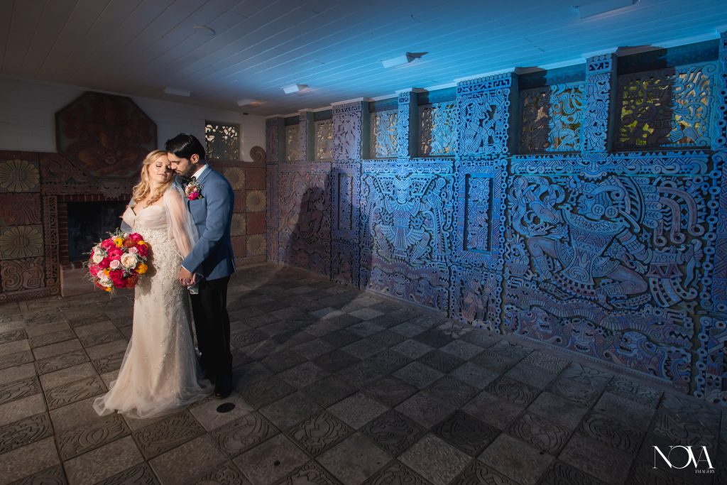 Bride and groom embracing at the Maitland Art Center