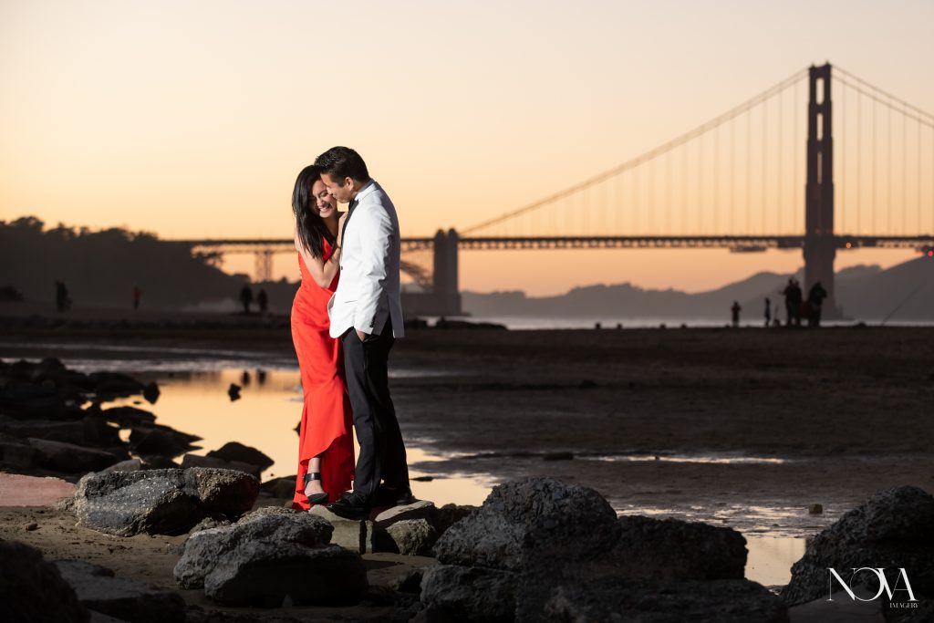 Groom-to-be whispering in his bride’s ear during their San Francisco engagement session.