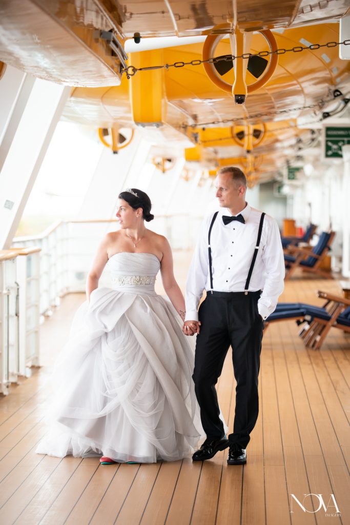 Couple casually walking during their Disney cruise wedding photo session..