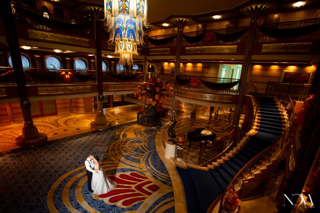 Bride and groom portrait in the Atrium of DCL Dream.