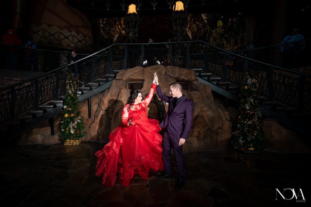 Couple twirling and having fun during their photo session at Disney’s Animal Kingdom Lodge.