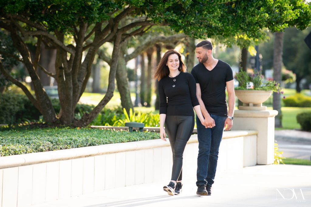 Couple casually walking during their Winter Garden engagement session.