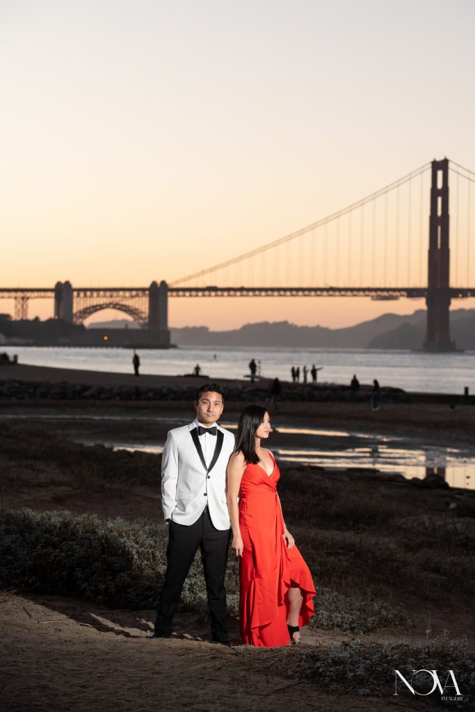 Couple stands in front of Golden Gate Bridge during their San Francisco engagement session.