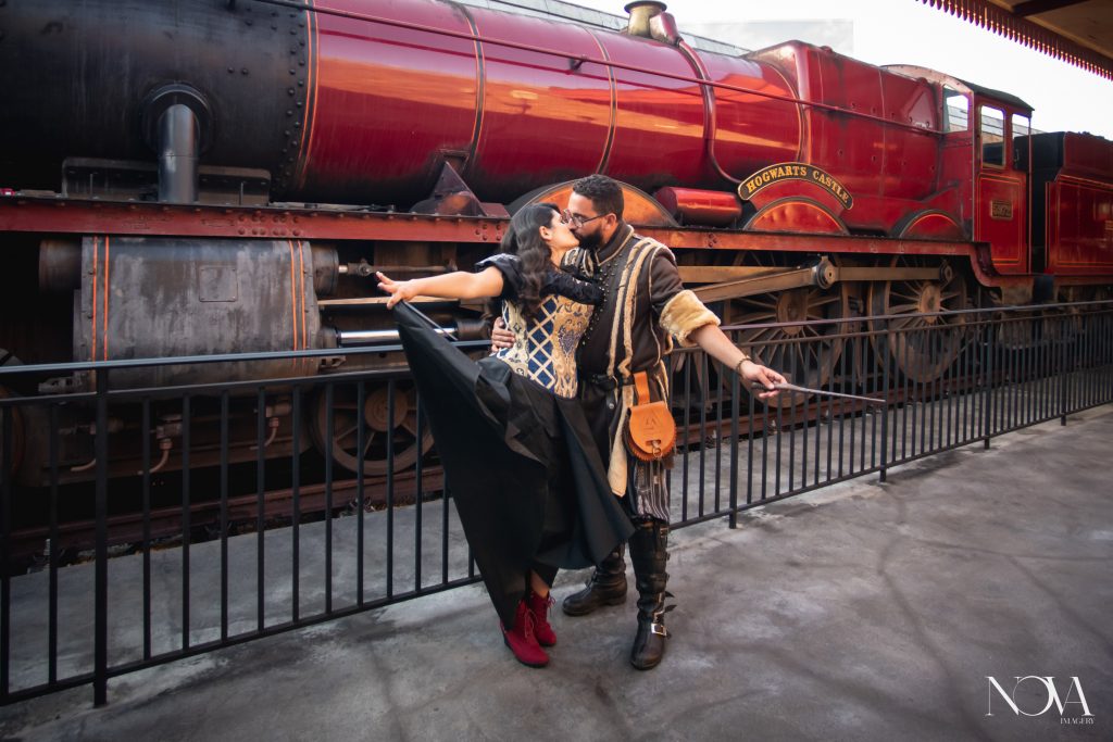 Couple in front of the Hogwarts Express for their Universal Studios engagement session.