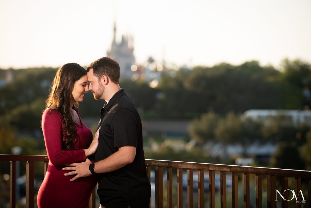 Couple embracing each other during their Disney’s Contemporary maternity session.