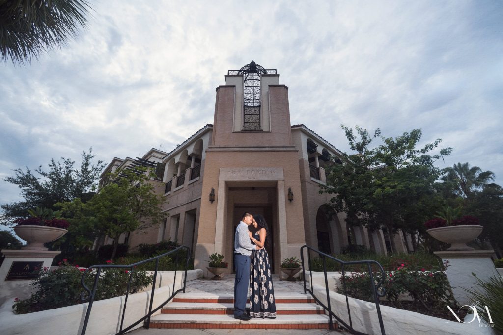 A couple standing on the steps of an Orlando photo spot in Winter Park.