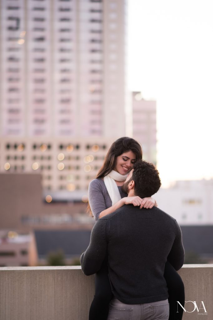 Couple sitting on parking garage rooftop in Downtown Orlando 