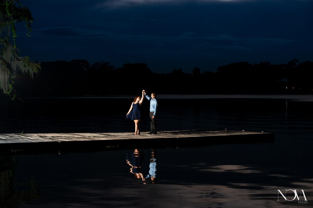 Couple dancing on the dock during sunset at Kraft Azalea Garden