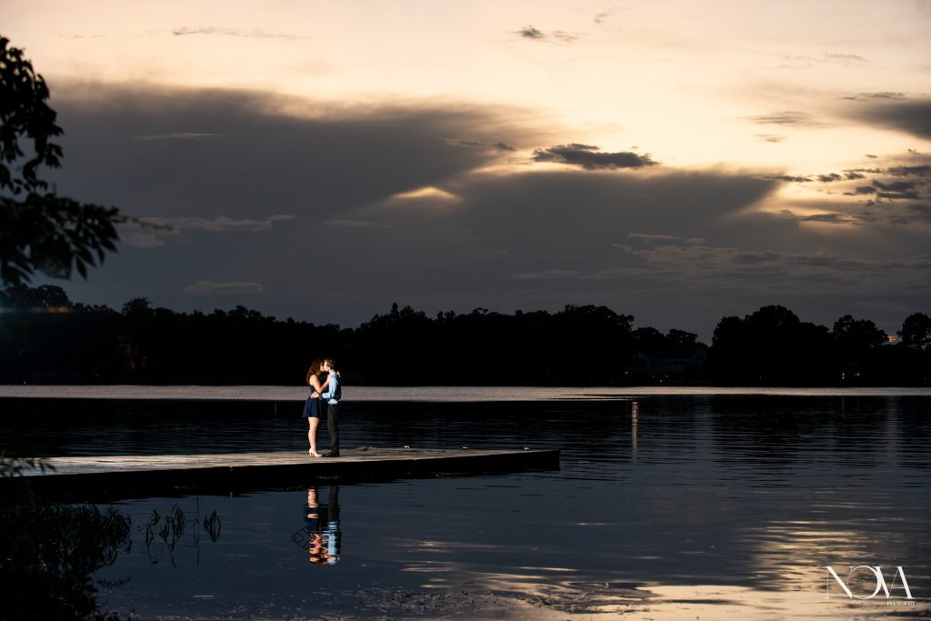 Couple kissing on the dock during their engagement session at Kraft Azalea