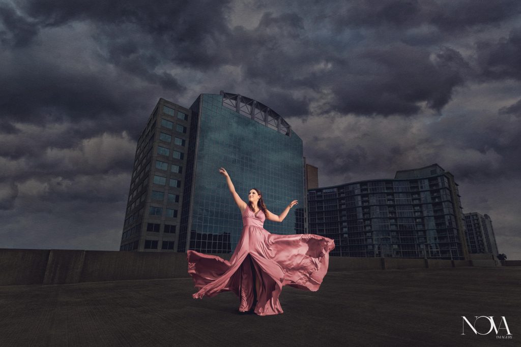 Dancing portrait on a rooftop during senior photoshoot in Downtown Orlando.