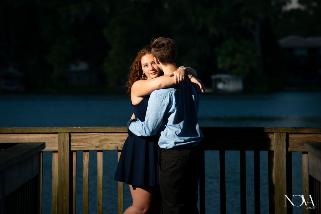 Couple hugging on the dock, at Kraft Azalea Garden