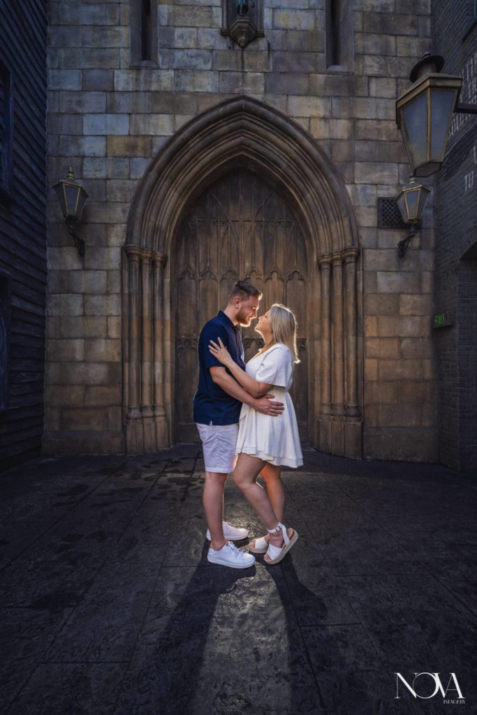Hogwarts proposal photography of couple by Diagon Alley