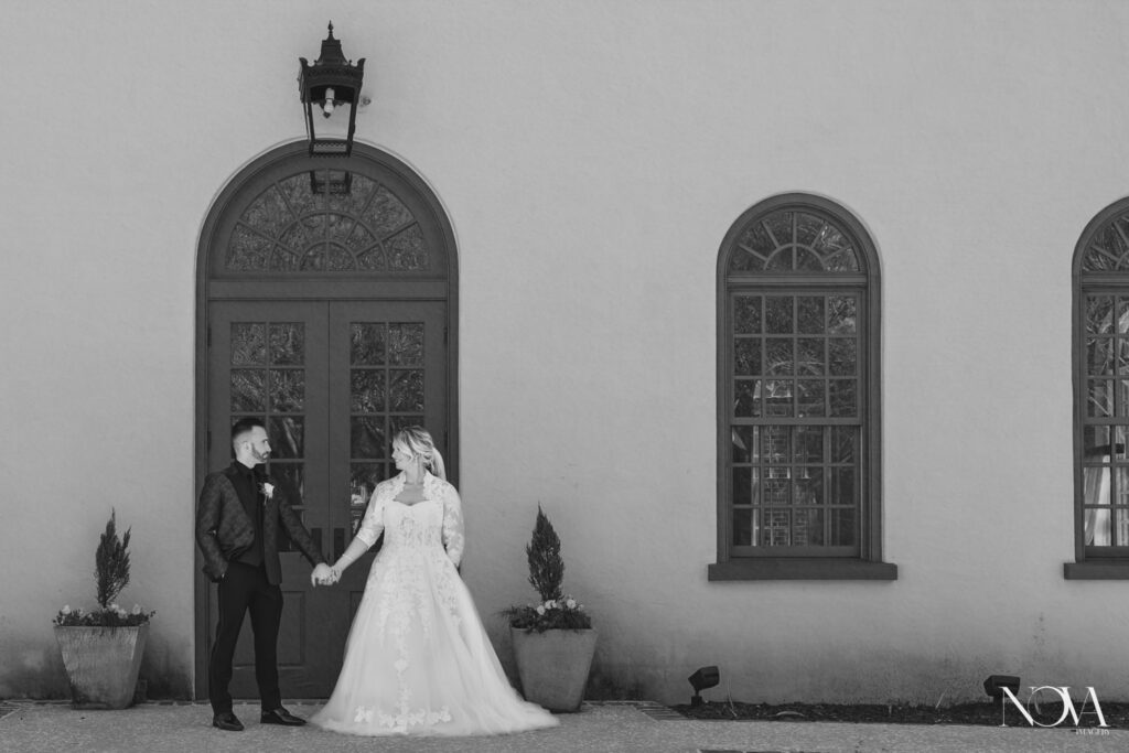 Bride and groom in front of chapel during one of the best months to get married in Orlando.