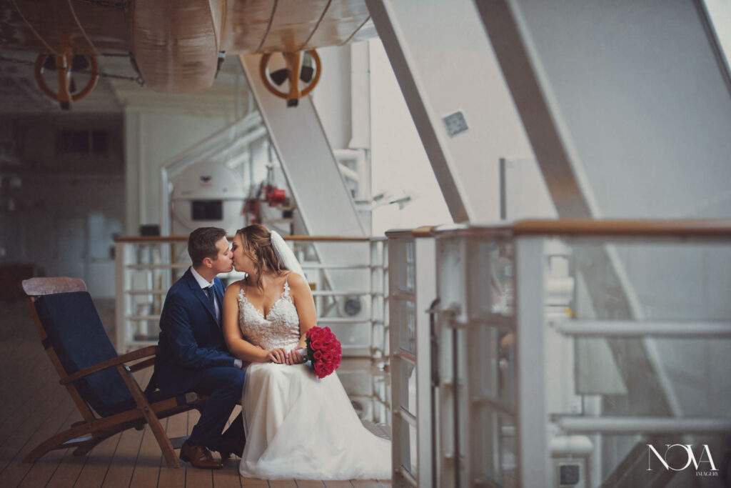 Bride and groom kissing after their wedding ceremony aboard Disney Cruise Line Dream ship.