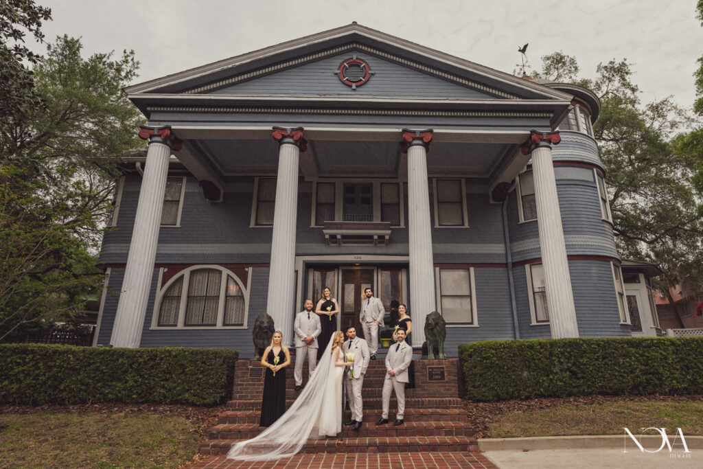 Exterior photo of Dr. Phillips House with wedding party for their photography.