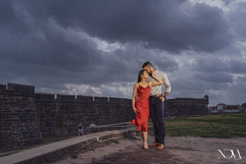 Couple standing in front of fort for their st augustine engagement session.
