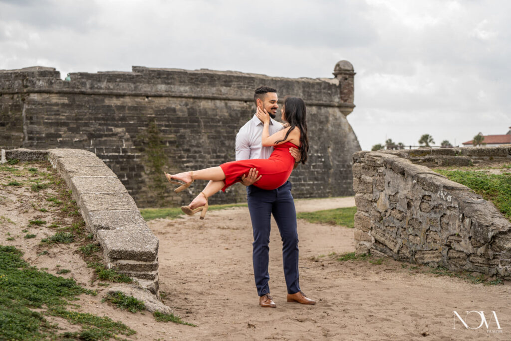 Couple twirling for engagement session in St. Augustine.