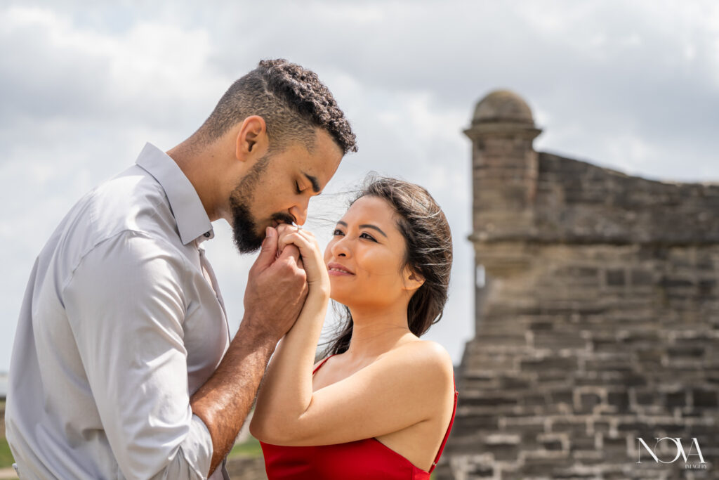 Fiance kisses ring hand during engagement session in St. Augustine.