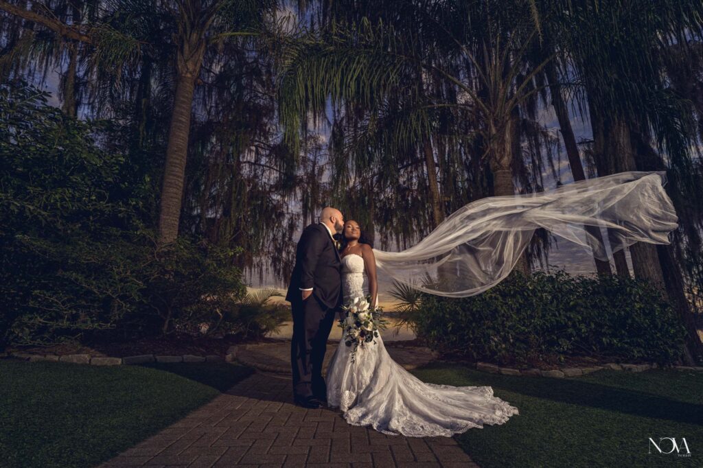 Wedding couple at their venue, Paradise Cove, in Orlando.